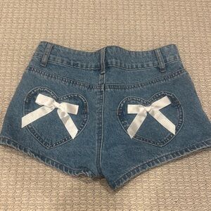 Edikted Blue Jean Shorts with Heart Accent Pockets and White Bows